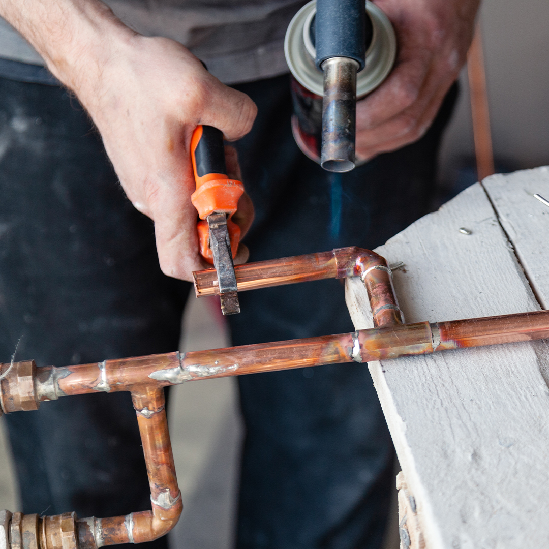 working on copper plumbing pipes